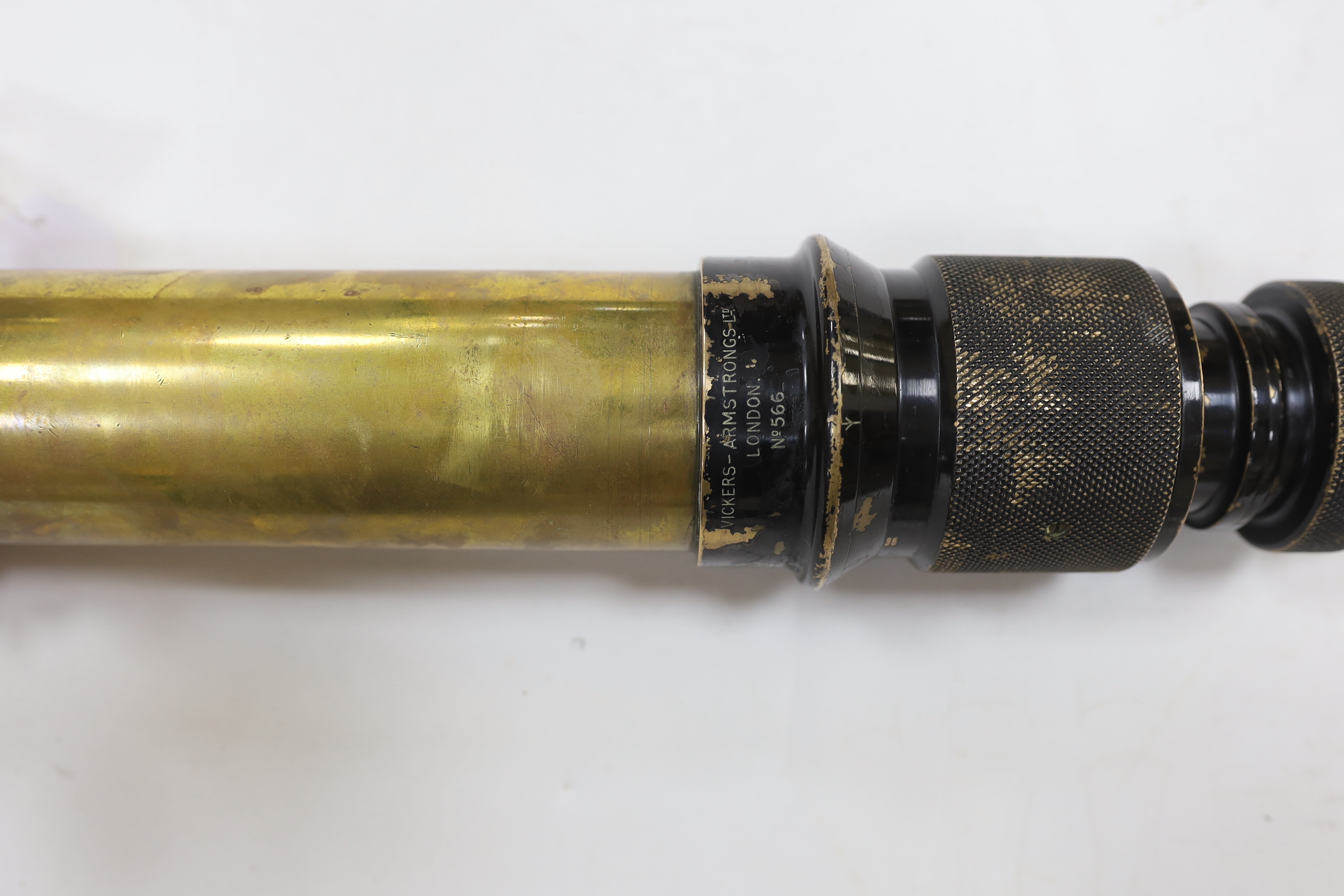 A First World War cased Vickers-Armstrongs Ltd, London, gun sighting telescope No.566, in fitted case with turned brass stand and colour filters, etc. applied brass plaque to the case; ‘CAIXA N45’, sight 52.5cm long, cas